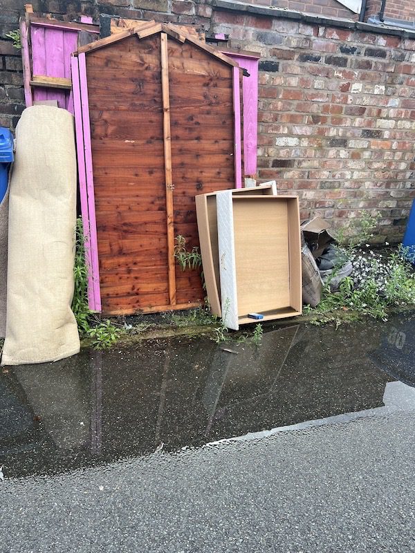 A fly tipped shed