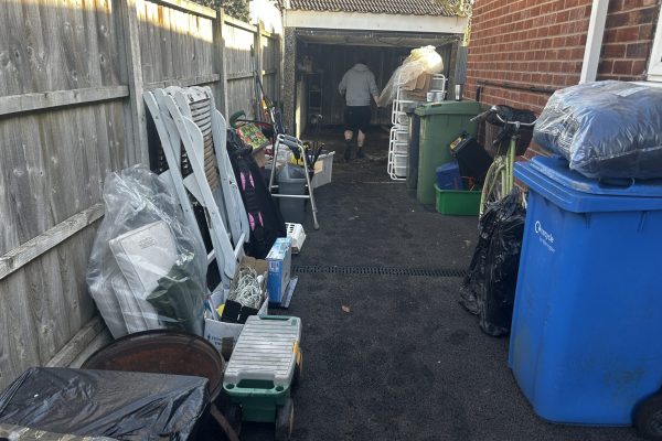 A garage in the process of being cleared by The Waste Clearance Team